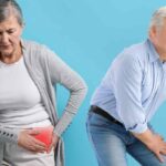 donna che mette le mani sull'anca e uomo che mette le mani sul ginocchio